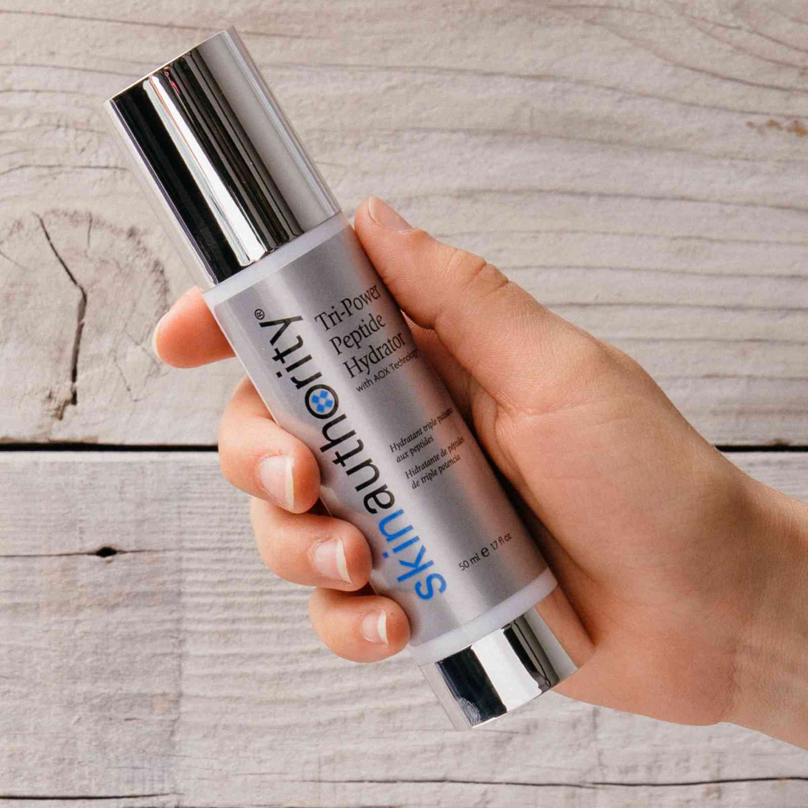 A Girl Holding Tri Power Peptide Hydrator