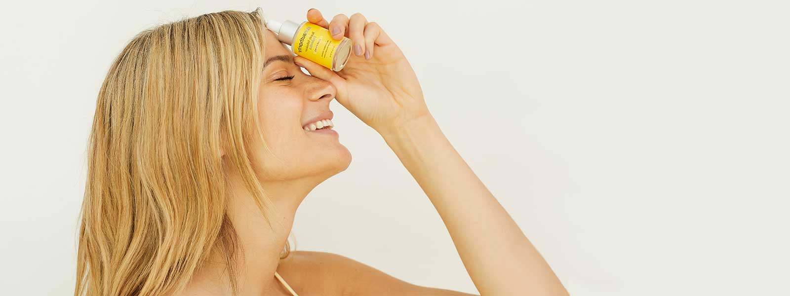 Photo girl holding Beauty Infusion for Clarifying by Skin Authority