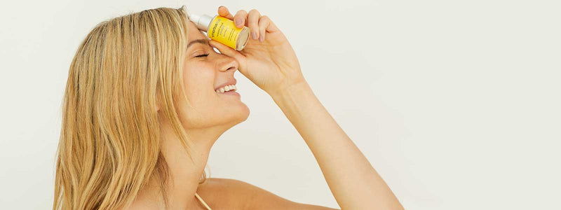 Photo girl holding Beauty Infusion for Clarifying by Skin Authority