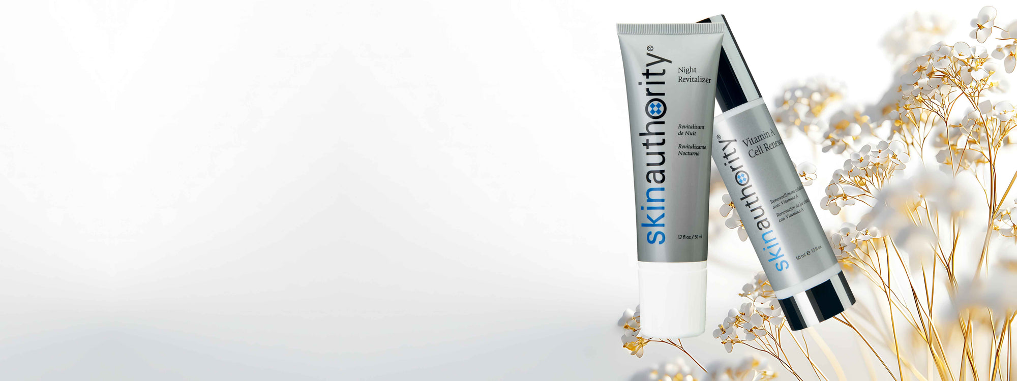 Two skincare bottles with a light background and decorative elements