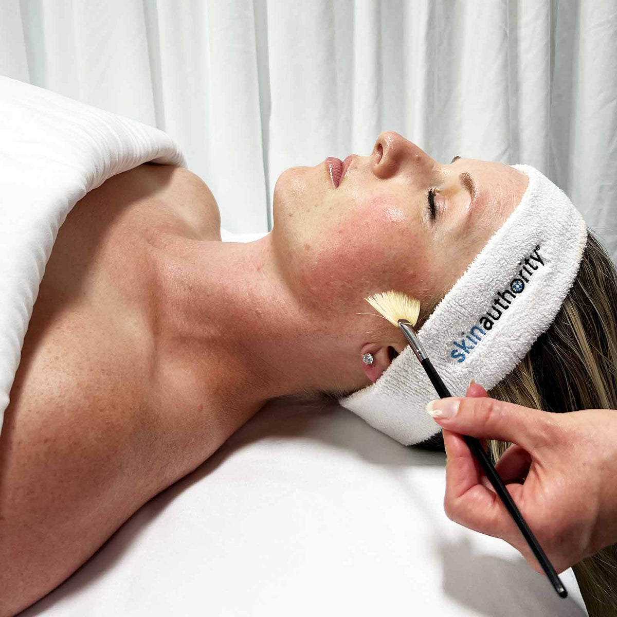 Woman receiving a Skin Authority Fear Free peel as part of a Transformation Facial Treatment. 