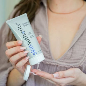 A Girl Applying Exfoliating Cleanser